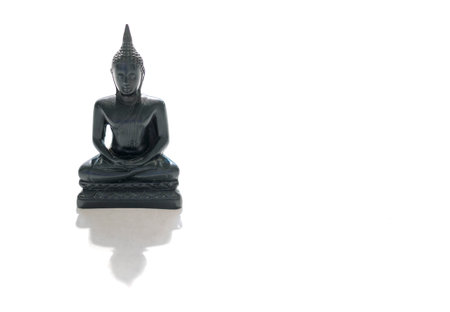 Black stone Buddha Figure Isolated On White backgroundの写真素材