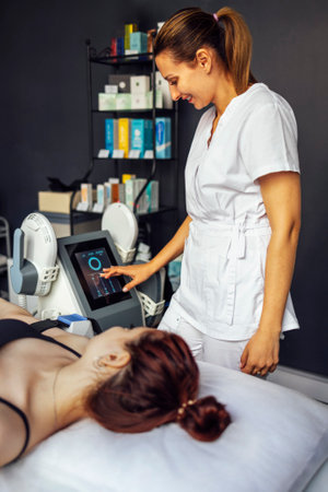 Woman getting treatment on buttocks to burn fat, build muscles and remove cellulite. professional beauty salonの写真素材