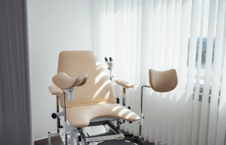 Gynecological chair. Modern bright office of the gynecologist. Sunny day.の写真素材
