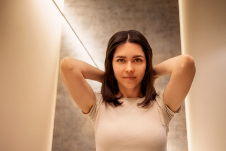 Close up of female portrait of attractive girl turns her head to the side and her hair fly. Young...