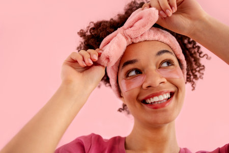 Smiling attractive mixed race girl with clean skin and pink patches under her eyes. Pretty young...