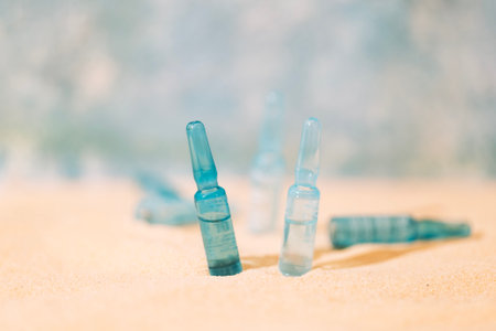 Blue ampoules with intense moisturizing concentrate with hyaluronic acid and vitamins on a...