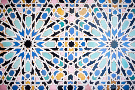 Detailed geometric tile pattern with vibrant colors and symmetrical shapes, highlighting traditional craftsmanship and artistic beauty in decorative art, Moroccoの写真素材