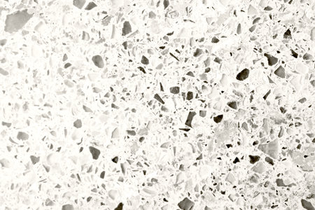 Granite texture with colorful pebbles. Bright glasses on a gray cement background. Ceramic granite backdrop.の写真素材