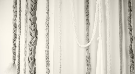 Wall adorned with braided materials in soft hues, highlighting craftsmanship and design, perfect for home decor ideas.の写真素材
