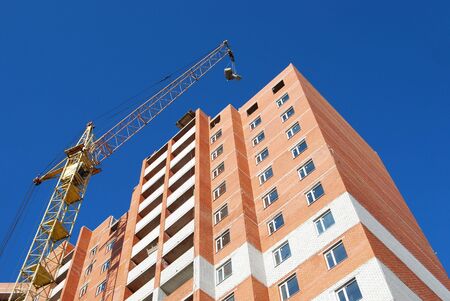 building tap with high-rise house on background blue sky