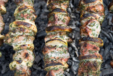 tasty shish kebab shashlik meat on skewer on coal の写真素材