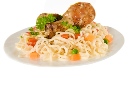 chicken and noodle on plate isolated over whiteの写真素材