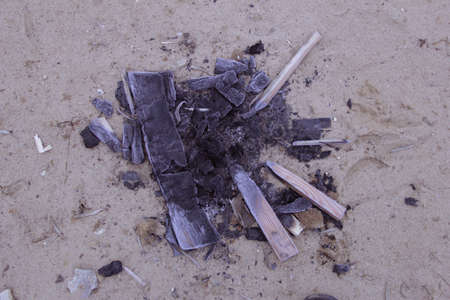 Ash in the sand without fire and peopleの写真素材