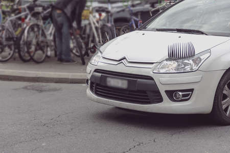 Nice white car with lash in cityのeditorial素材