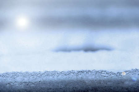 Winter early sunny cold morning with ice in windowの写真素材