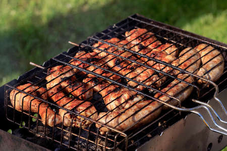 Chicken aromatic skewers on grill at summer gardenの写真素材