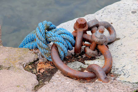 Nice blue rope knot tied at dockの写真素材