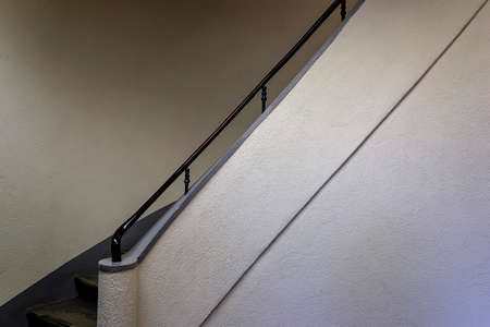 Fragement of spiral white and gray staircase in big houseの写真素材