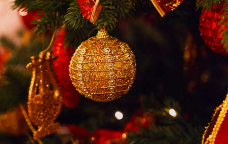 Golden nice ball on family Christmas treeの写真素材