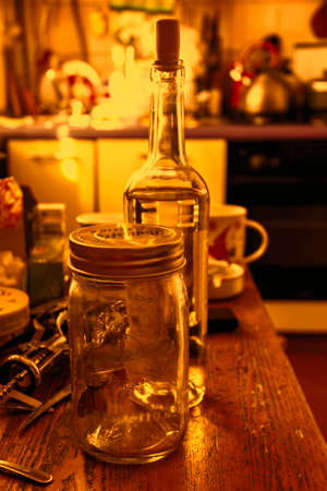 Still life in kitchen with bottle of wine in red tonesの写真素材
