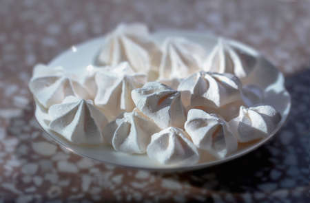 Beauty tender meringue on white plate for desertの写真素材