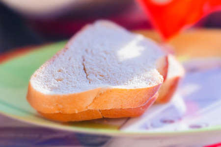 Nice pieces of white bread in sunlightの写真素材