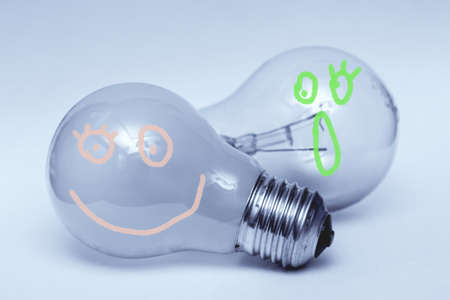 Two cute lamps with eyes on gray backgroundの写真素材