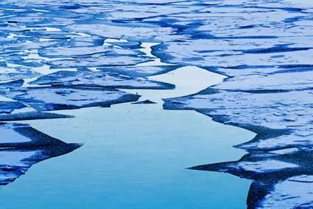Great geometry of ice on water at dusk
