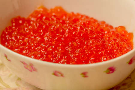 Fresh red caviar in white bowl for partyの写真素材