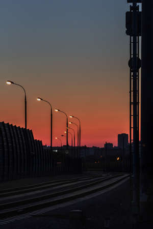 Nice panorama of evening railroad lanterns in cityの写真素材