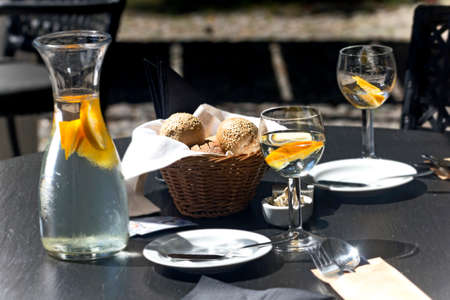 Beautiful table setting black wooden table on sunny day