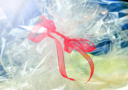 Nice red ribbon for gift wrapping in lightの写真素材