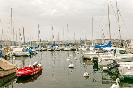Jeneve, Switzerland - october 4, 2013: centre if city on Lac Leman, Geneve Lake, at autumn cloudy...