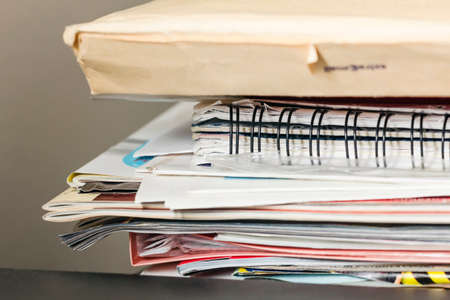 Stack of magazines and papers in room