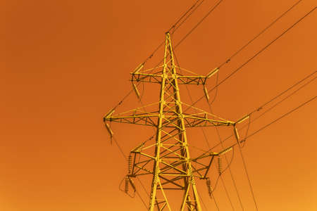 High tower power line on red sky backgroundの写真素材