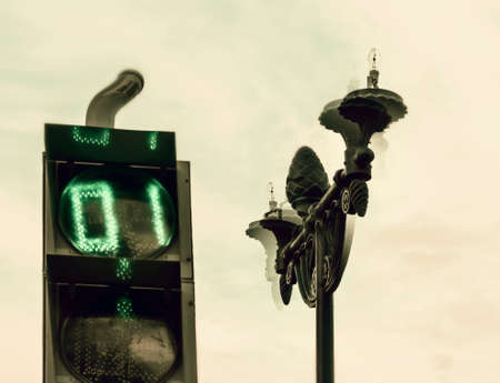 Strange traffic light and lantern at cloudy dayの写真素材