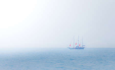 Nice ship with scarlet sails on sea horizonの写真素材