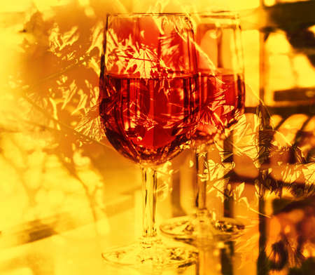 Two glasses of red wine at sunny day, collageの写真素材
