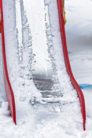 Hill with snow on playground at winter dayの写真素材
