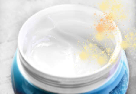 White face cream in blue jar closeupの写真素材