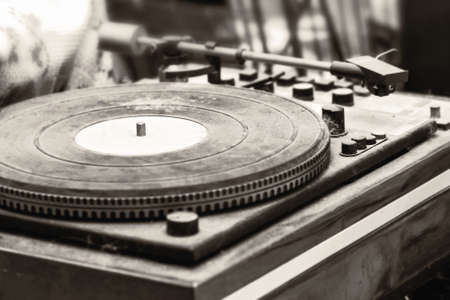 Old dusty record player like vintage surprise in sepia