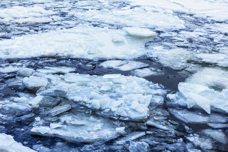 Pieces of ice in winter cold waterの写真素材