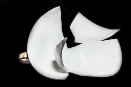 Shards of broken cup on black backgroundの写真素材