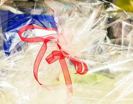 Transparent paper for gift with red ribbonの写真素材