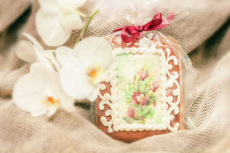 Festive gingerbread with decoration and orchid for surprise