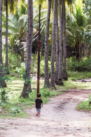 January, 5. 2017, Gili air, Indonesia - little boy in palm grove