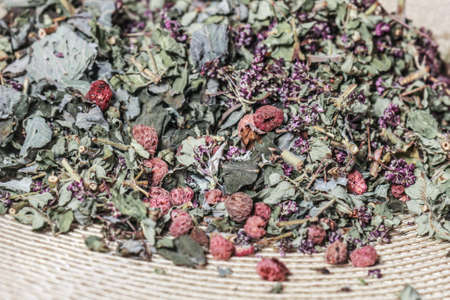 Dry herbal tea with raspberry berries for tasty party and healthの写真素材