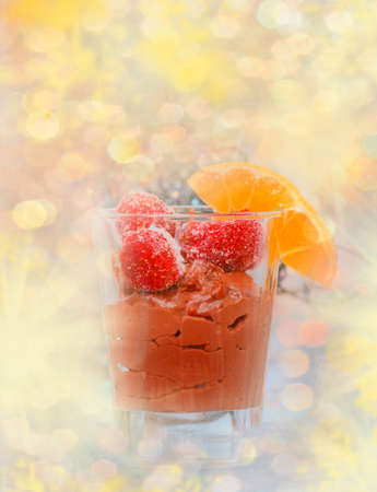 Chocolate mousse in glass cup with strawberries for tasty supper
