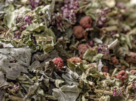 Dry summer  grass with raspberries for tea and cozy moodの写真素材