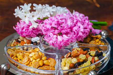 Appetite nuts and white and pink hyacinths flowersの写真素材
