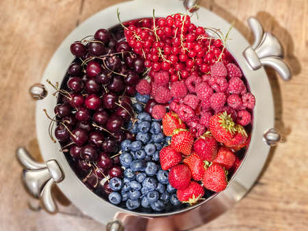 Great best plate with multicolor berries for tasty eating at summer and good mood all yearの写真素材