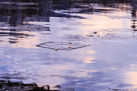 Real deep soft twilight purple sky is reflected in winter riverの写真素材