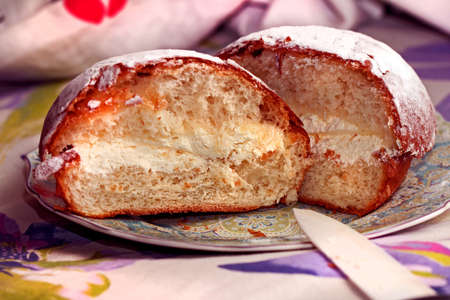 Real yummy tasty fresh butter cake with cream cut in half