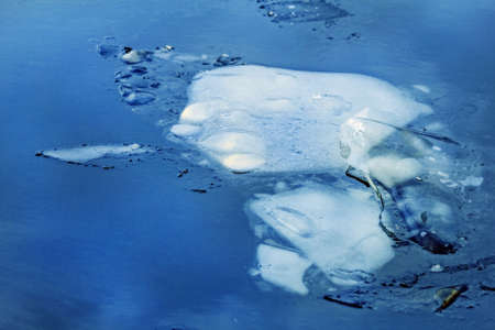 Real pretty large ice floe in blue winter deep waterの写真素材